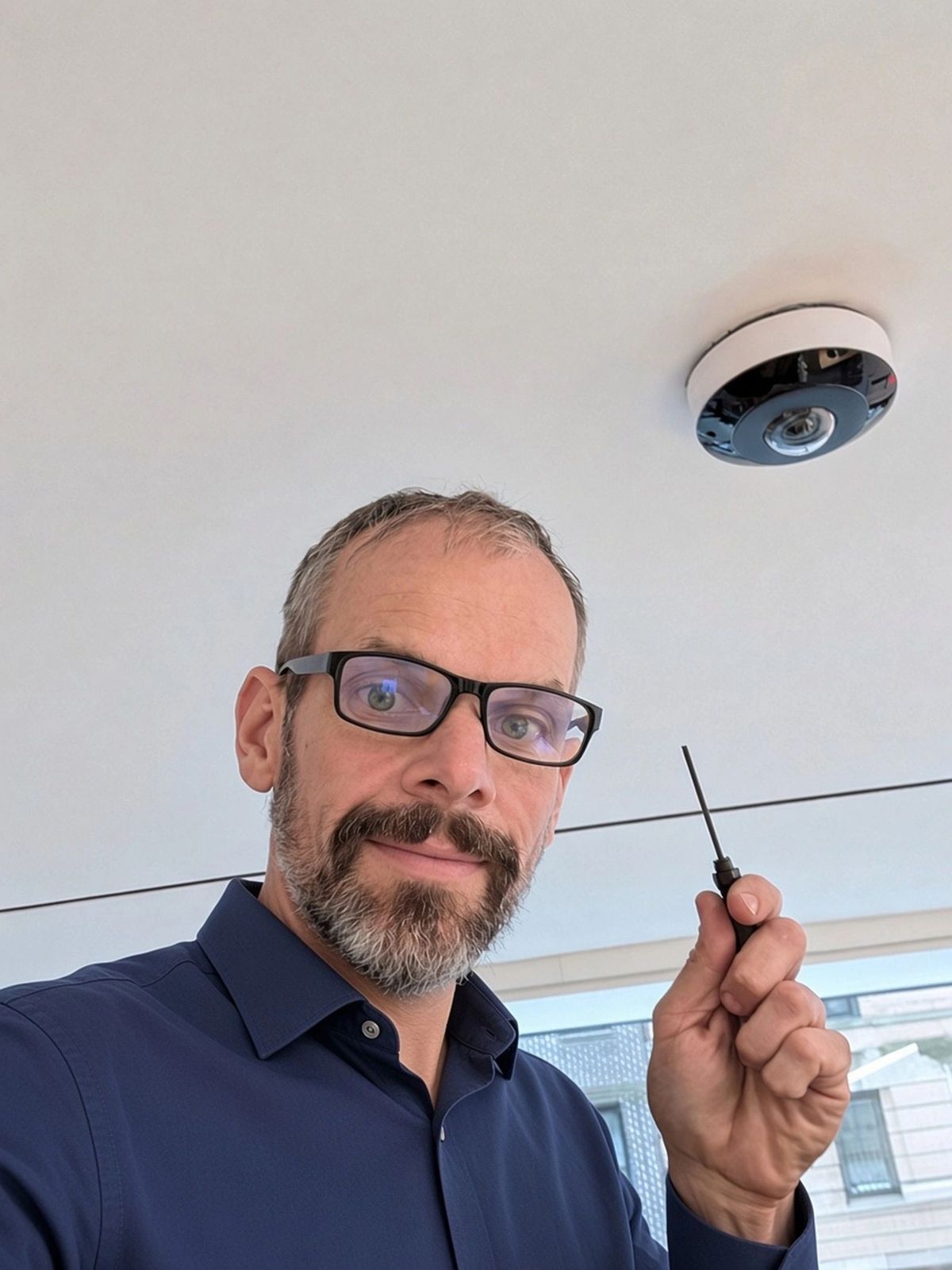 Kevin Erdmann of Netsource Partners with a 360-degree security camera